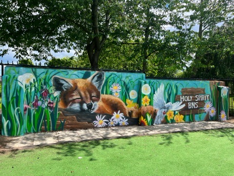 A sleeping fox mural among flowers and a small bird